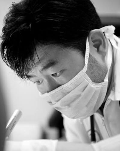 Dr. Bryan H. Kim examining a patient